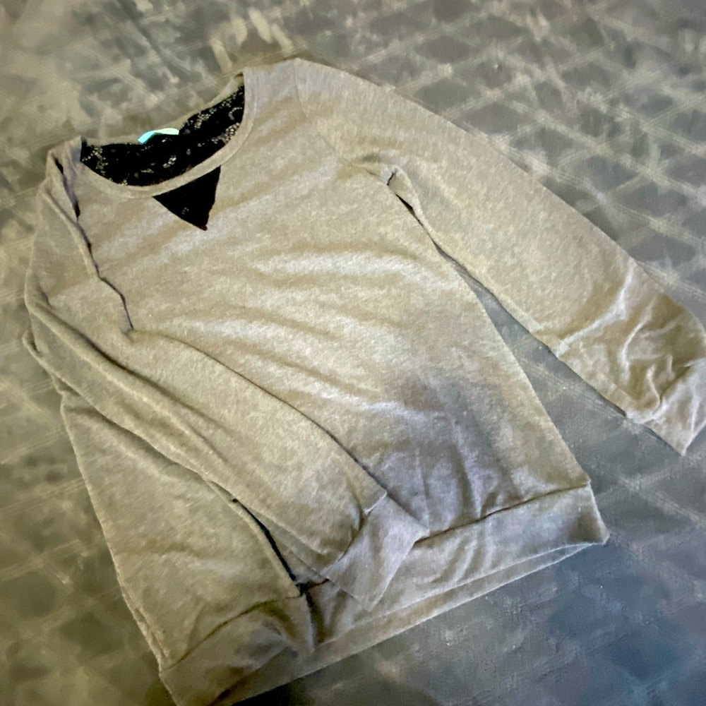 Dark gray with distressed back black lace peeking through long sleeve top